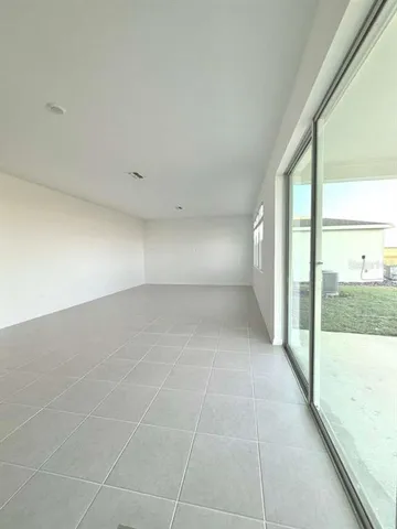 a white toilet sitting next to a white cabinet