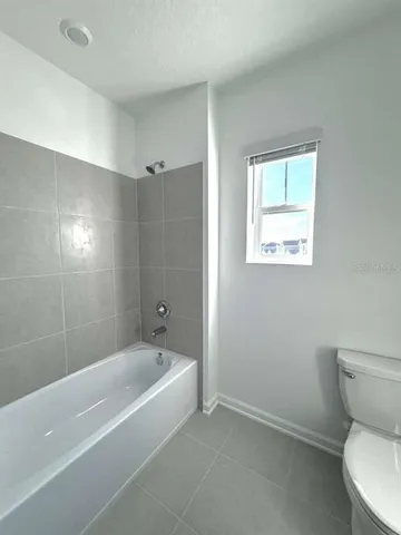 a bathroom with a double vanity sink and mirror