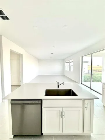 a kitchen with a sink and a window