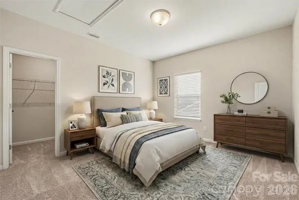 a bedroom with a bed and window