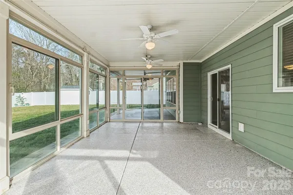a view of an empty room with a sliding door