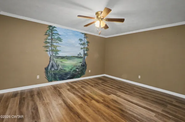 a view of room with window and ceiling fan