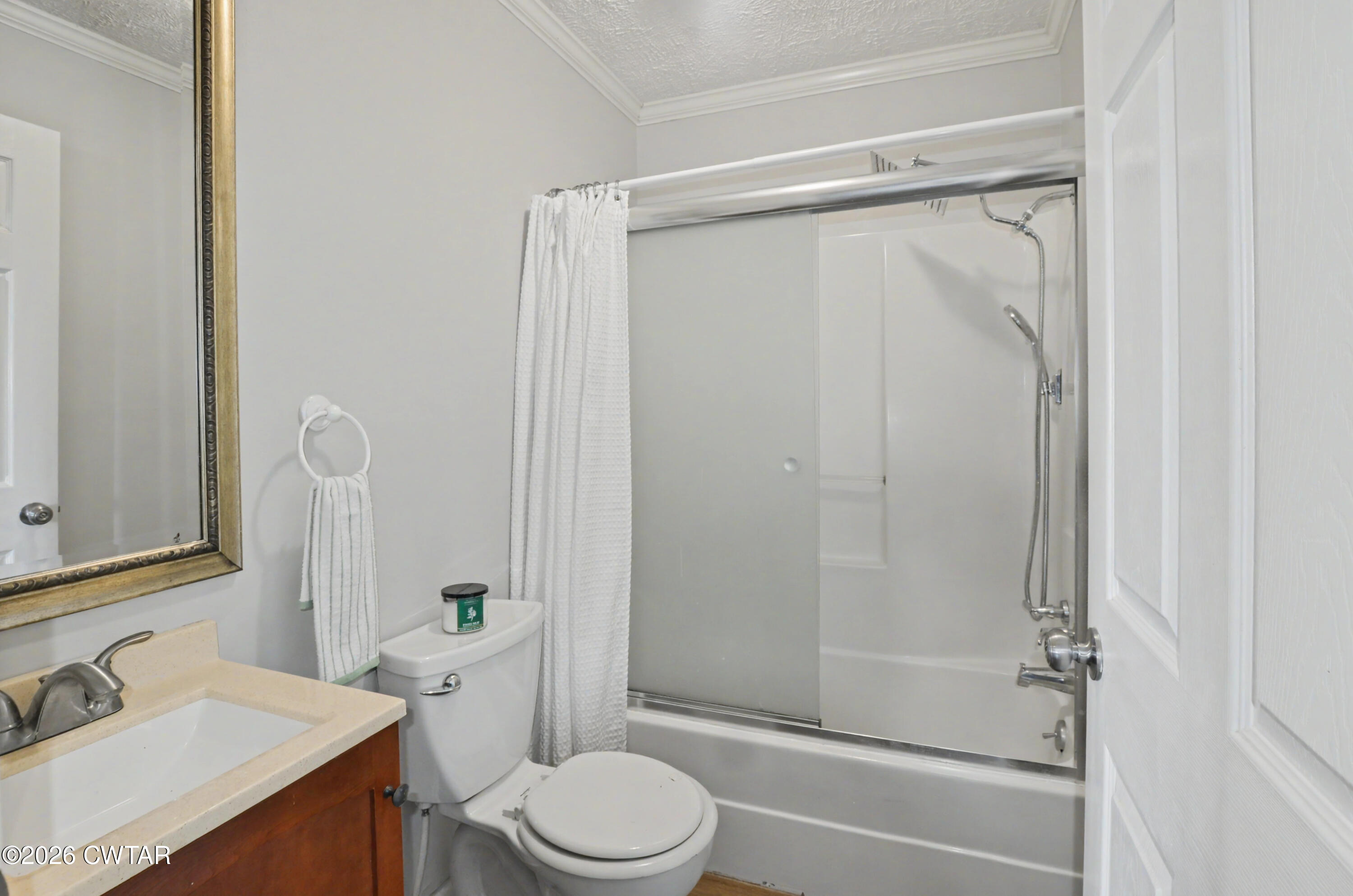 593 Sunny Hill Road Alamo, TN 38001 - Photo 28 of 29 a bathroom with a shower a toilet and sink