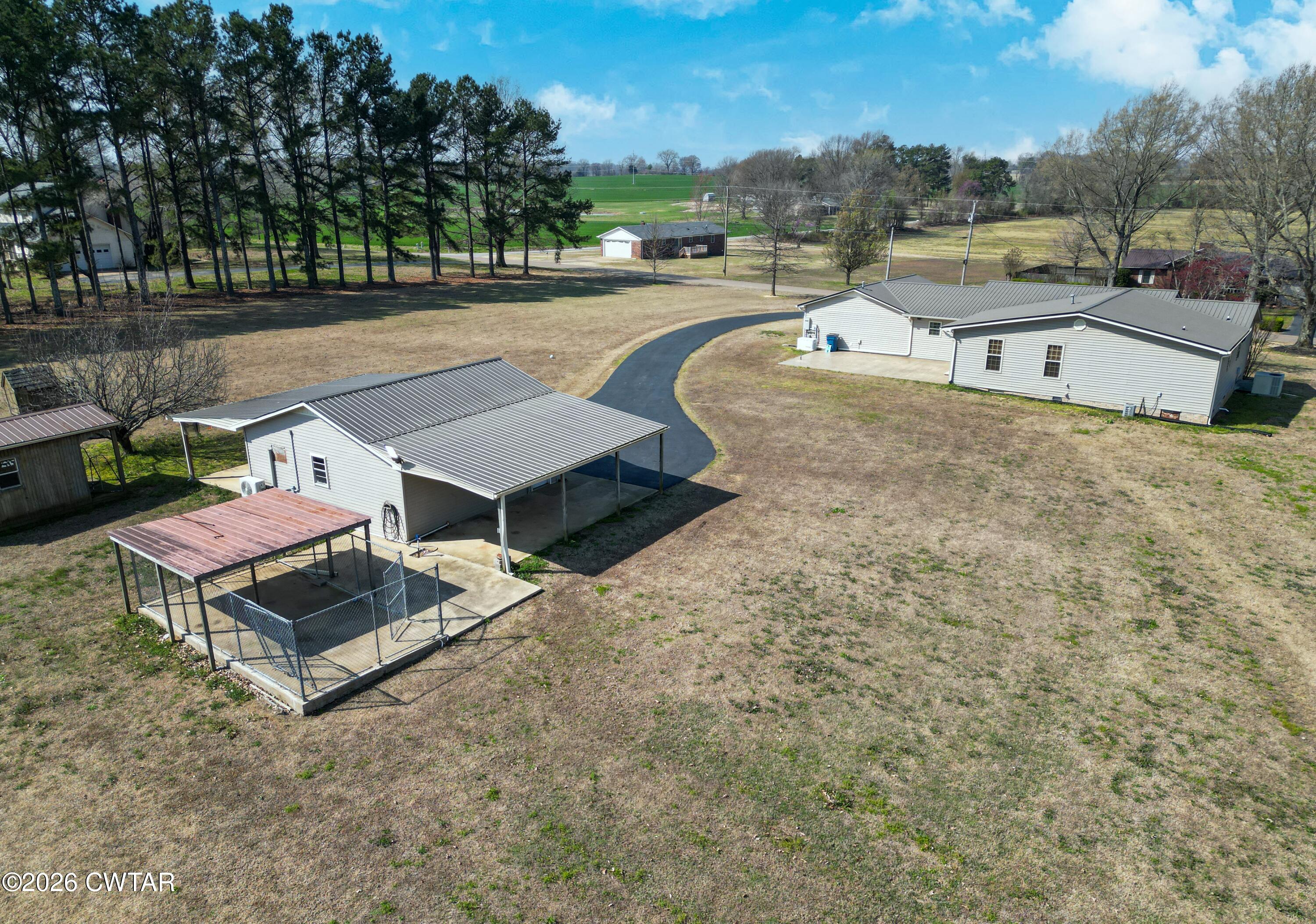 593 Sunny Hill Road Alamo, TN 38001 - Photo 4 of 29 a swimming pool with outdoor seating and yard