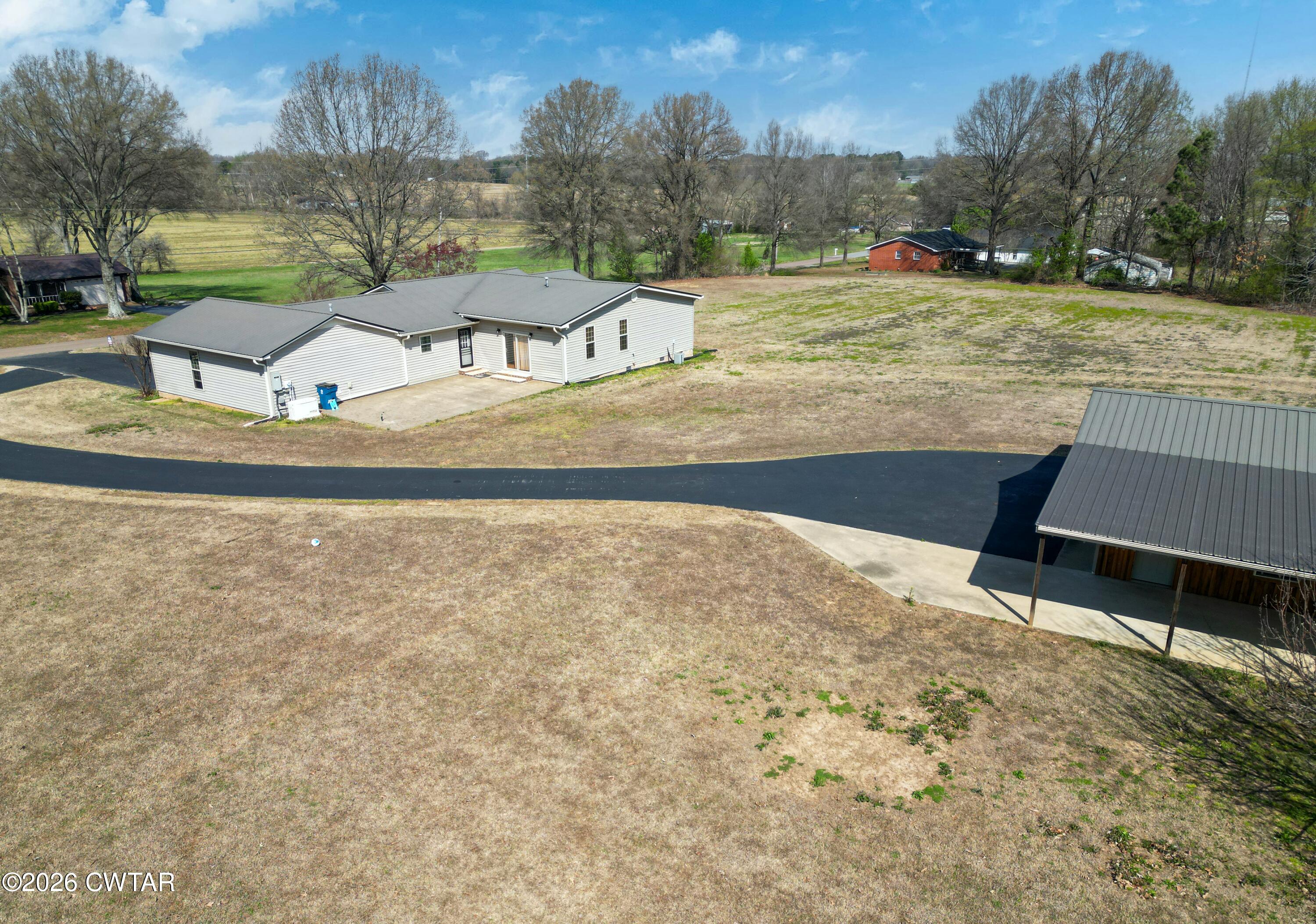593 Sunny Hill Road Alamo, TN 38001 - Photo 5 of 29 a view of a house with a yard
