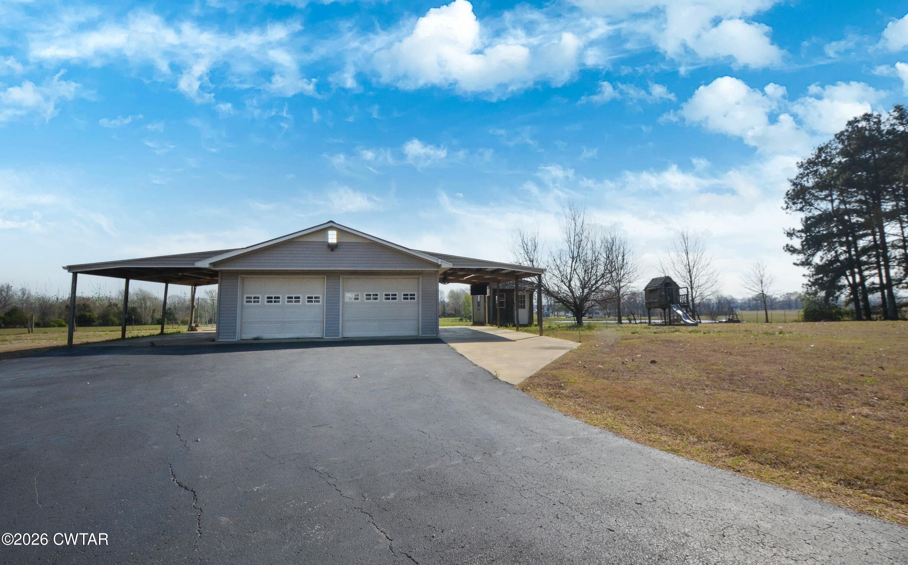 593 Sunny Hill Road Alamo, TN 38001 - Photo 10 of 29 a view of a house with a yard