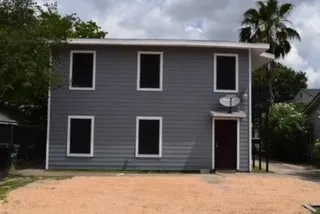 a house that has a window in front of it
