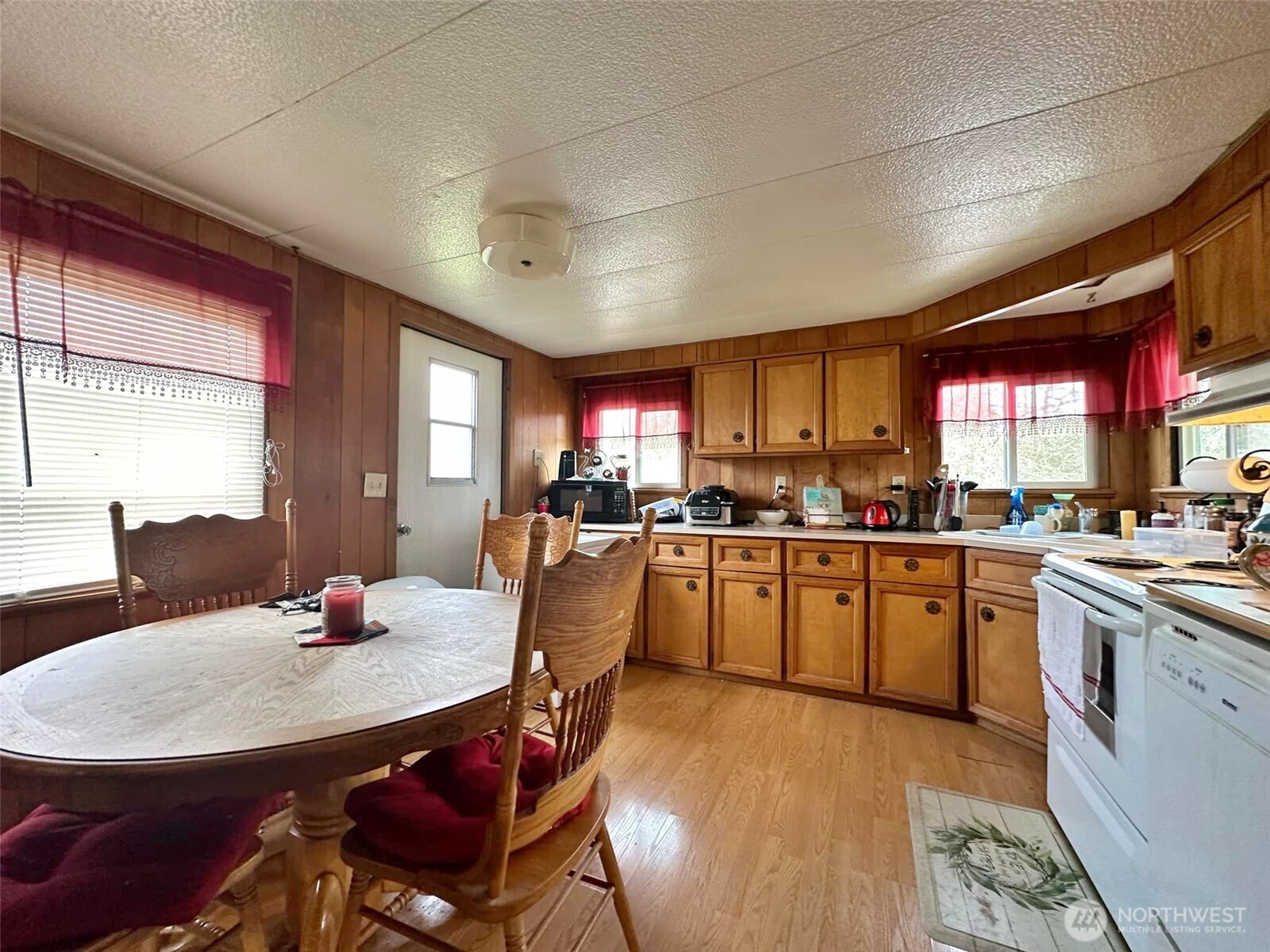 338 Berry Road Chehalis, WA 98532 - Photo 9 of 11 a kitchen with stainless steel appliances granite countertop a kitchen island a stove a table and chairs