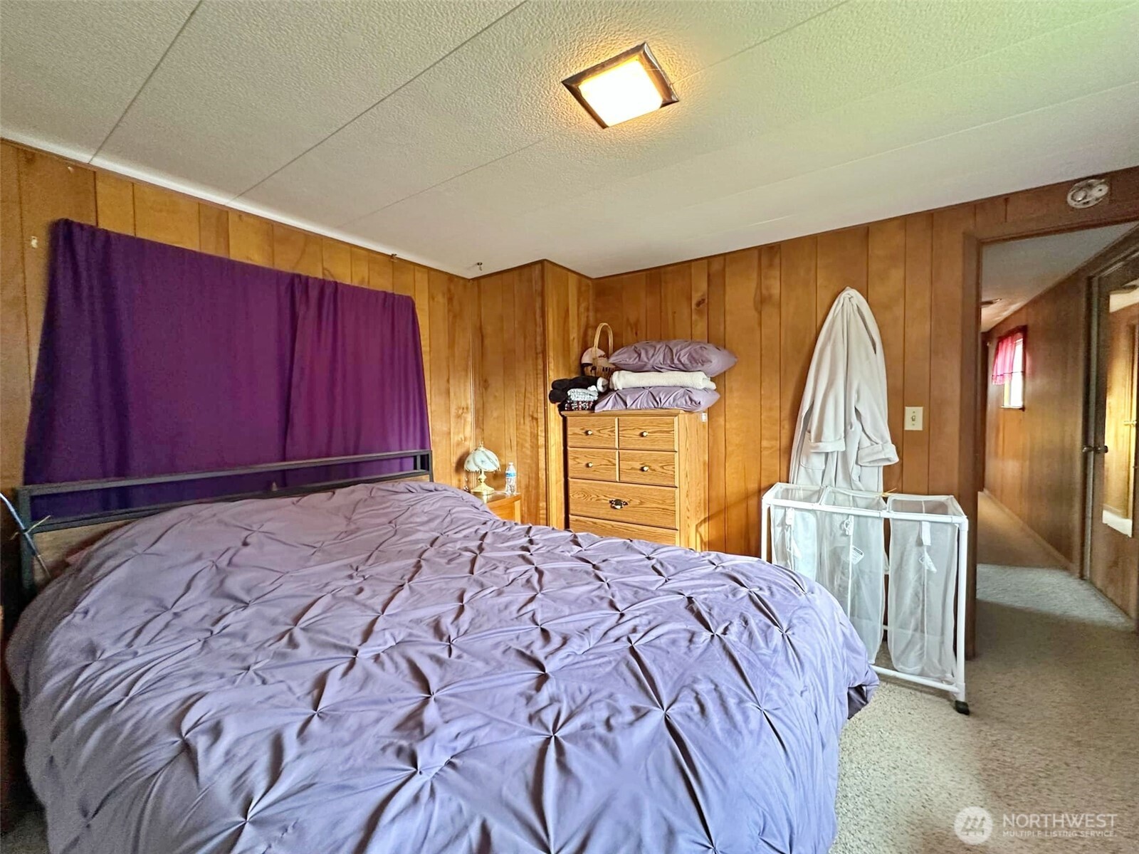 338 Berry Road Chehalis, WA 98532 - Photo 10 of 11 a bed sitting in a spacious bedroom next to a window