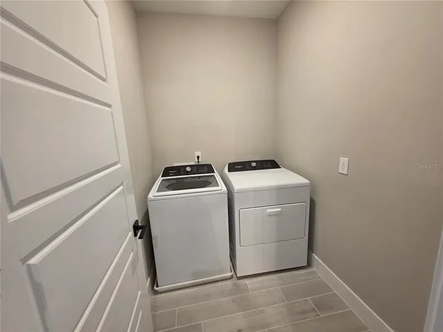 a utility room with dryer and washer