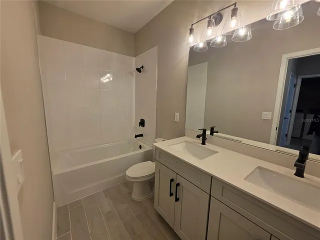 an empty room with a empty space and windows