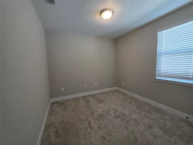 a view of a yard with a swimming pool