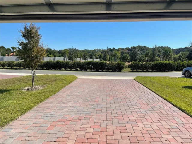 a view of a lake with a house in the background