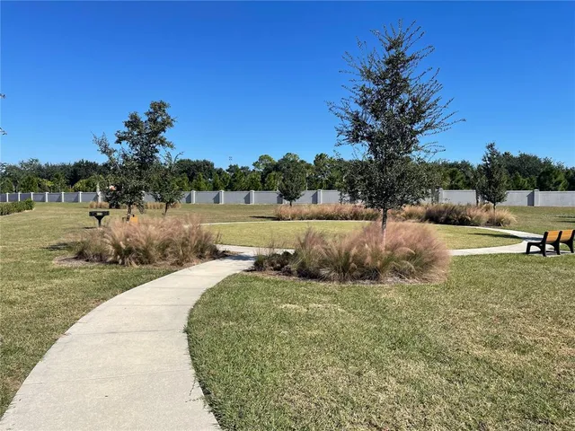 a view of swimming pool with outdoor seating and city view