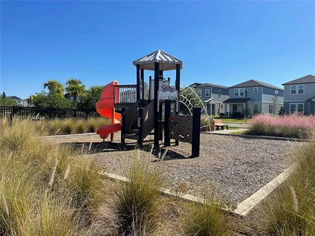 a view of a swimming pool and a yard