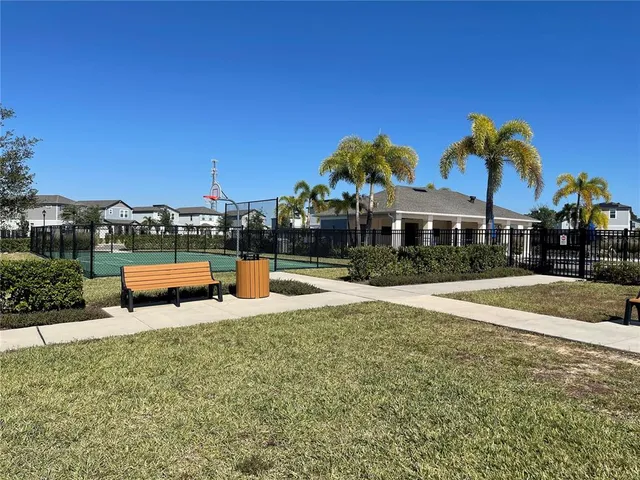 a front view of a house with swimming pool having outdoor seating