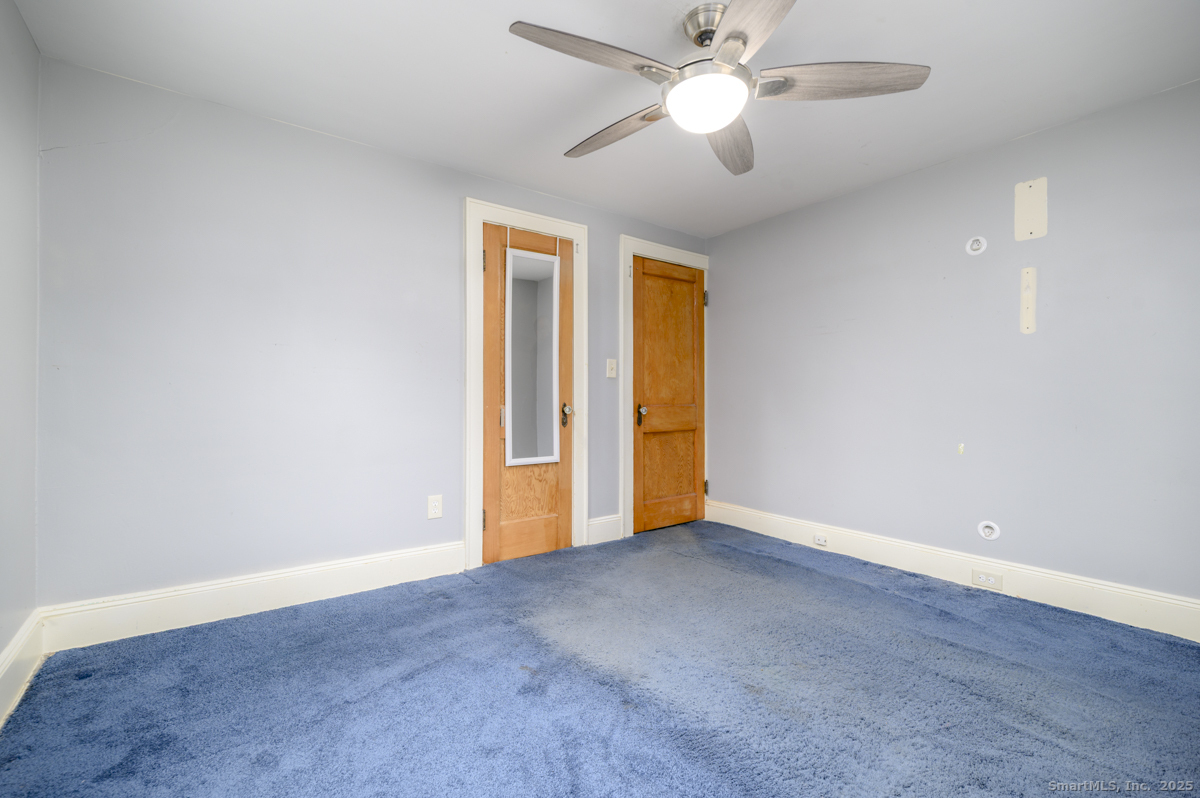 279 Knapps Highway Fairfield, CT 06825 - Photo 13 of 24 wooden floor in an empty room