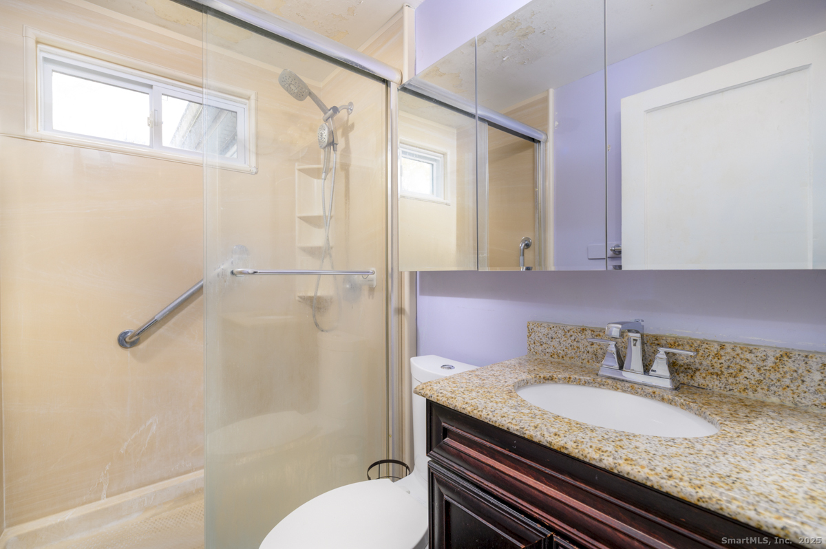 279 Knapps Highway Fairfield, CT 06825 - Photo 14 of 24 a bathroom with a granite countertop sink toilet and shower