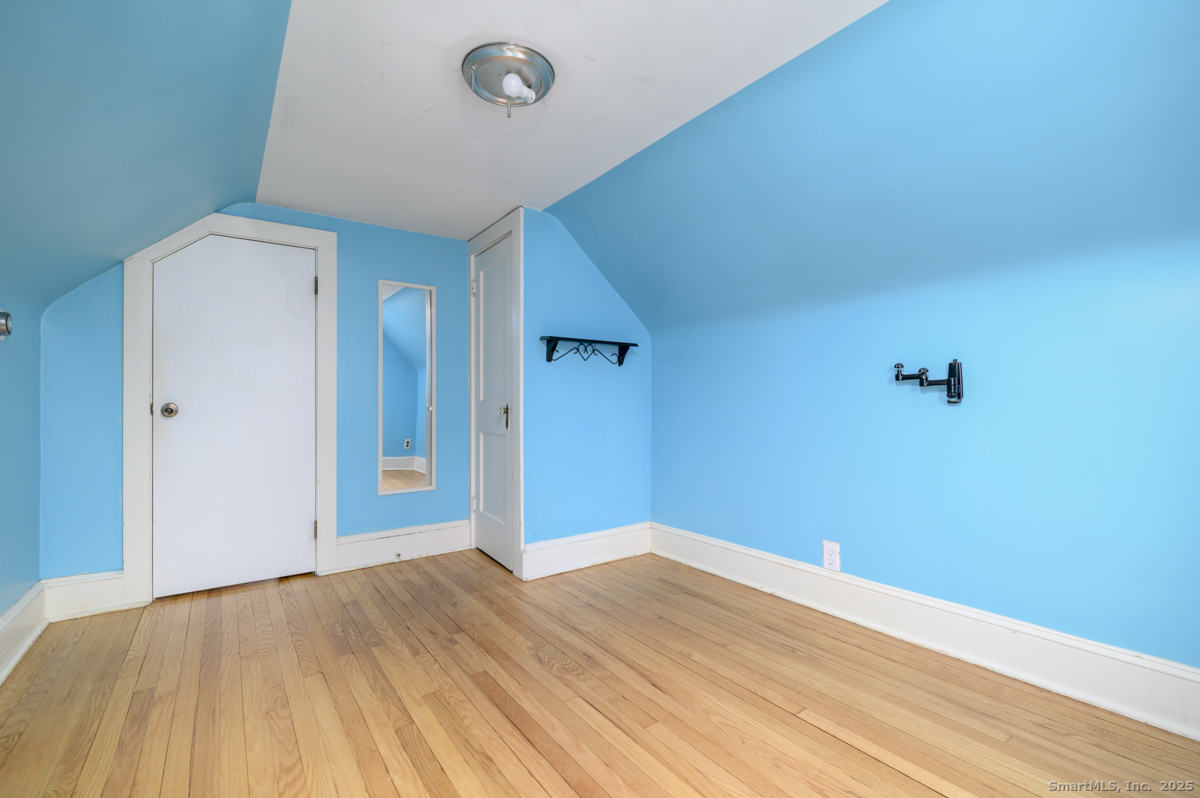 279 Knapps Highway Fairfield, CT 06825 - Photo 16 of 24 a view of empty room with wooden floor