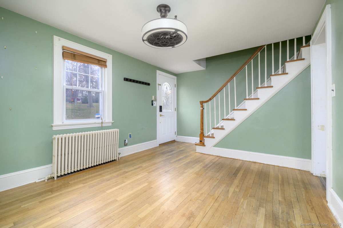 279 Knapps Highway Fairfield, CT 06825 - Photo 2 of 24 a view of an entryway with staircase