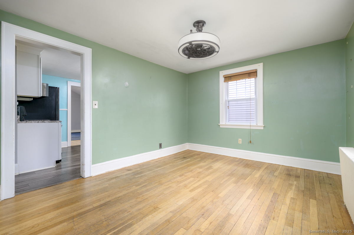 279 Knapps Highway Fairfield, CT 06825 - Photo 4 of 24 a view of empty room with wooden floor