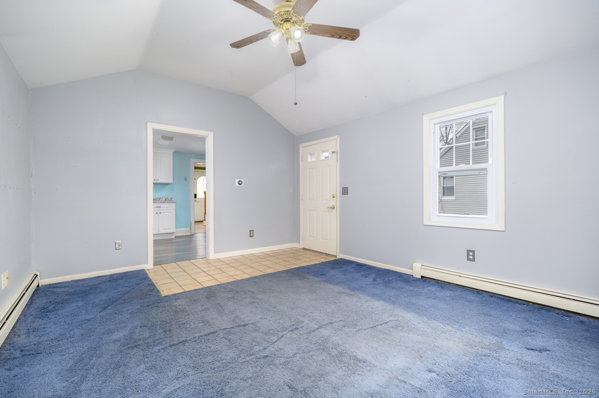 279 Knapps Highway Fairfield, CT 06825 - Photo 9 of 24 wooden floor in an empty room with a window