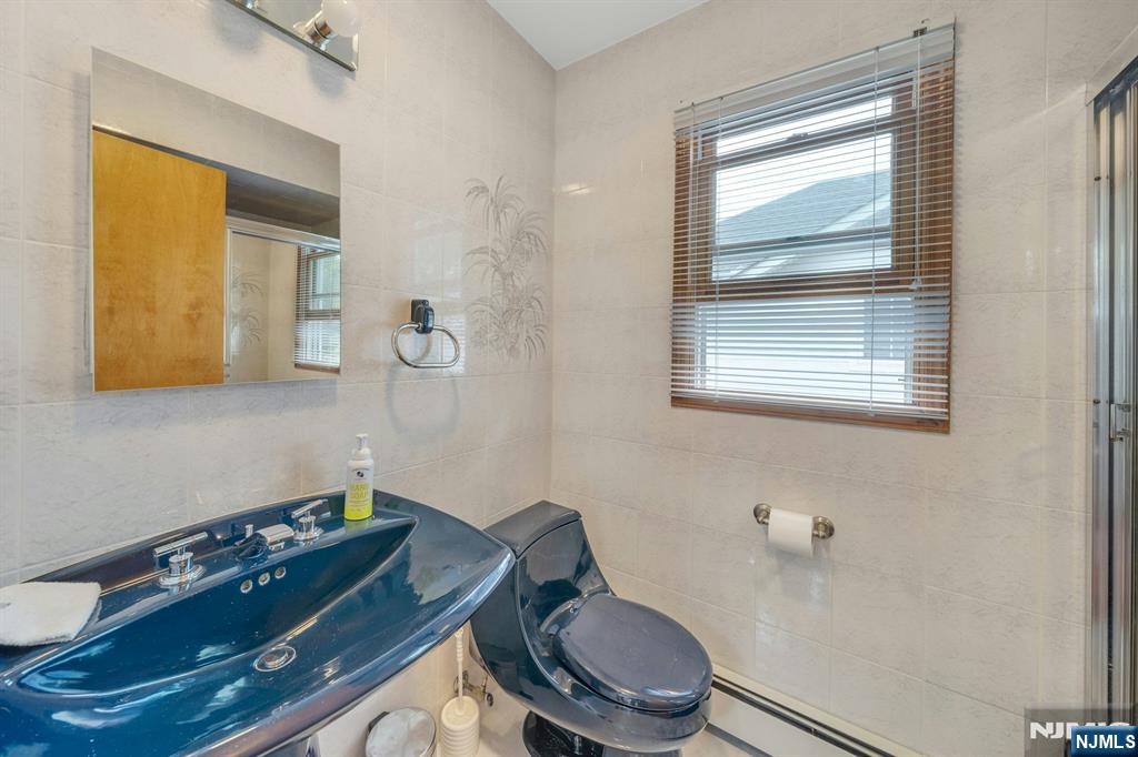 24 Cambridge Road Tenafly, NJ 07670 - Photo 21 of 31 a bathroom with a toilet