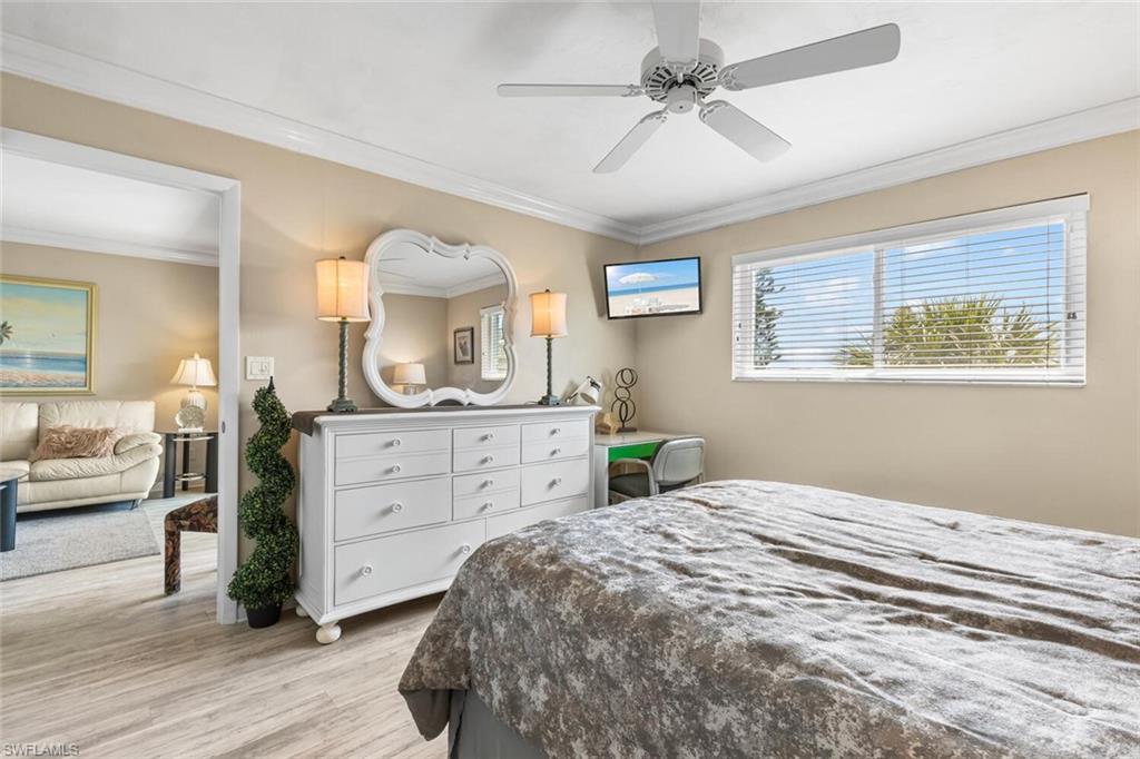 1004 Manatee Road, Unit H306 Naples, FL 34114 - Photo 16 of 48 a bedroom with a bed and a dresser