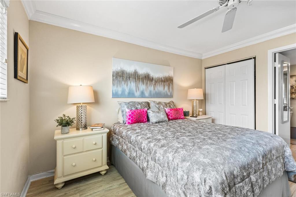 1004 Manatee Road, Unit H306 Naples, FL 34114 - Photo 17 of 48 a bedroom with a bed and a closet