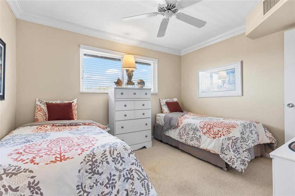 1004 Manatee Road, Unit H306 Naples, FL 34114 - Photo 21 of 48 a bedroom with a bed and a window