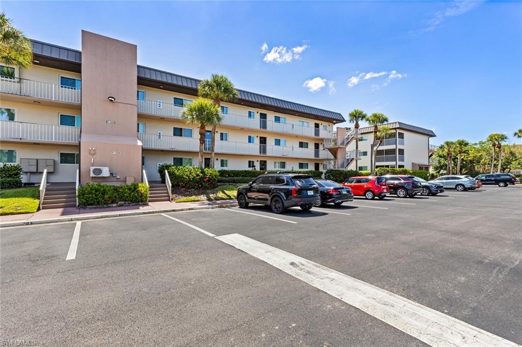 1004 Manatee Road, Unit H306 Naples, FL 34114 - Photo 27 of 48 a car parked in front of a building