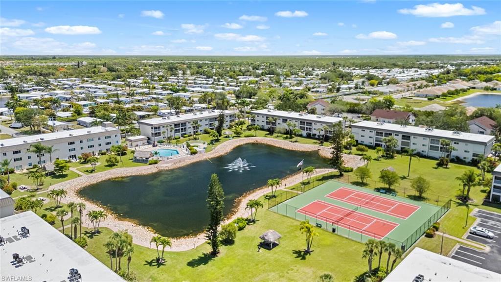 1004 Manatee Road, Unit H306 Naples, FL 34114 - Photo 29 of 48 an aerial view of a swimming pool with a yard