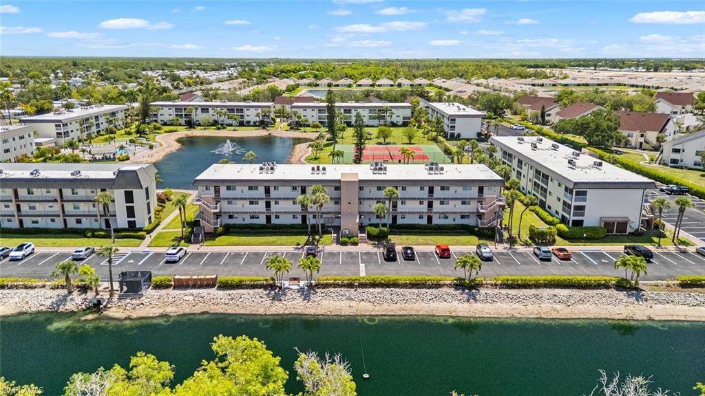 1004 Manatee Road, Unit H306 Naples, FL 34114 - Photo 32 of 48 a view of an swimming pool and lake view