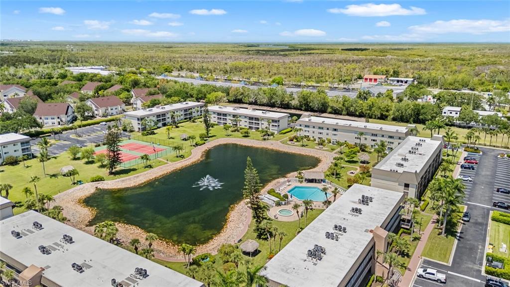1004 Manatee Road, Unit H306 Naples, FL 34114 - Photo 35 of 48 an aerial view of a house with a swimming pool