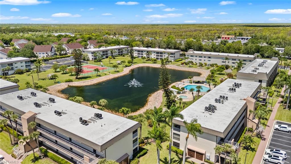 1004 Manatee Road, Unit H306 Naples, FL 34114 - Photo 36 of 48 an aerial view of a residential building with swimming pool and lake view
