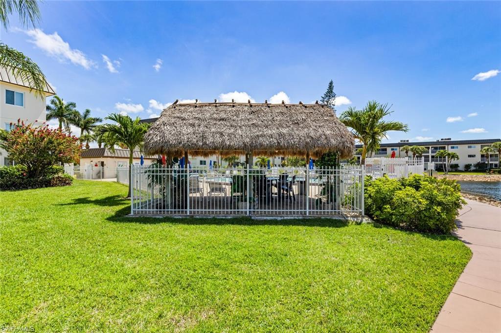 1004 Manatee Road, Unit H306 Naples, FL 34114 - Photo 40 of 48 a view of a house with a yard porch and sitting area