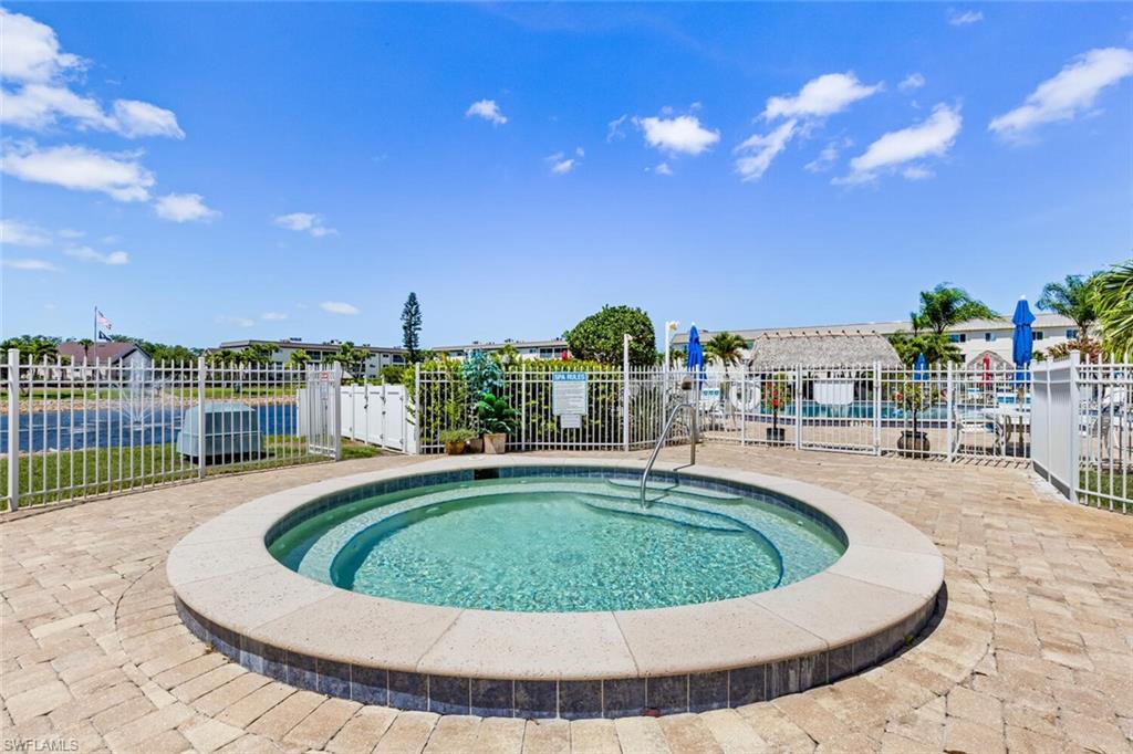 1004 Manatee Road, Unit H306 Naples, FL 34114 - Photo 41 of 48 a view of a swimming pool with a patio