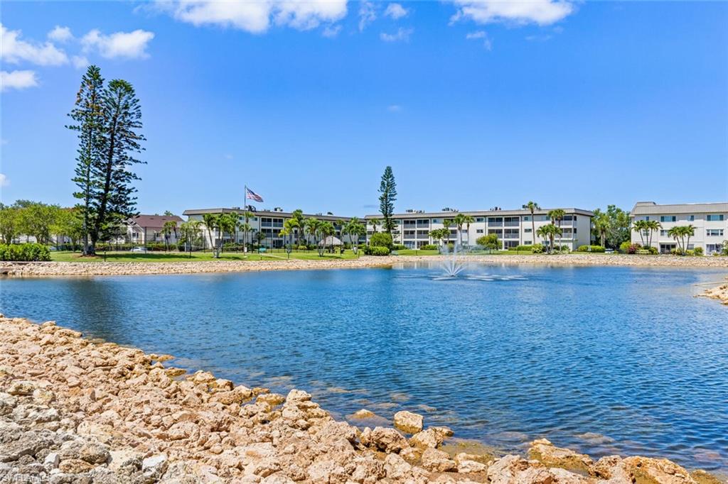 1004 Manatee Road, Unit H306 Naples, FL 34114 - Photo 43 of 48 a view of a water with boats and trees in the background