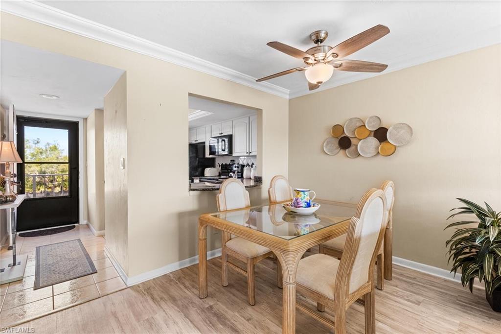 1004 Manatee Road, Unit H306 Naples, FL 34114 - Photo 6 of 48 a dining room with furniture and wooden floor