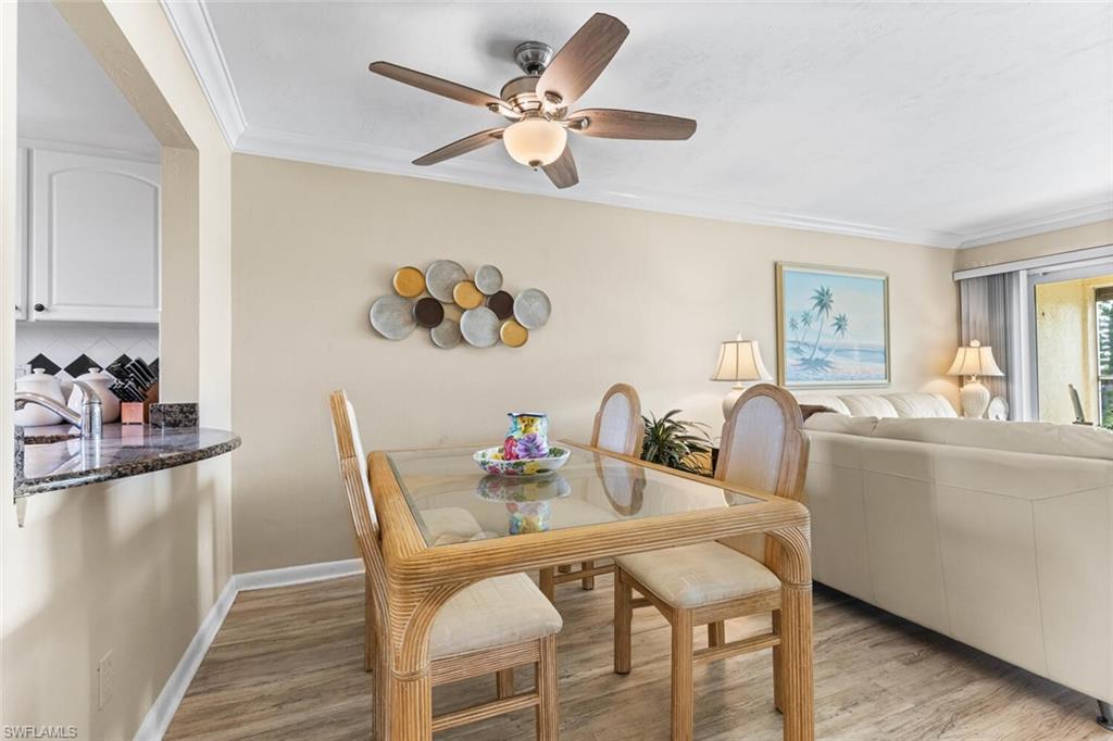 1004 Manatee Road, Unit H306 Naples, FL 34114 - Photo 7 of 48 a dining room with furniture and window