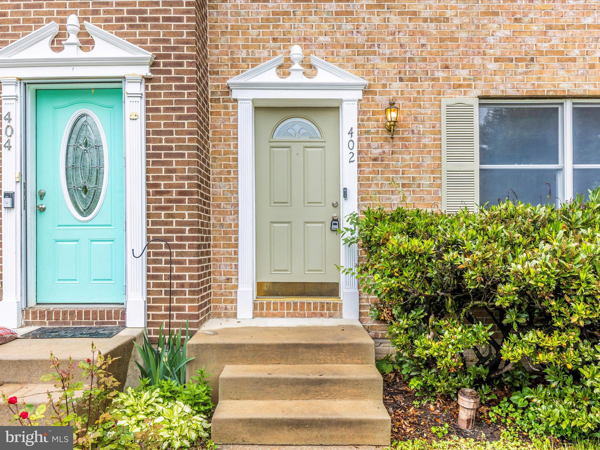 402 Windy Knoll Drive Mount Airy, MD 21771 - Photo 2 of 51 a front view of a house with a garden