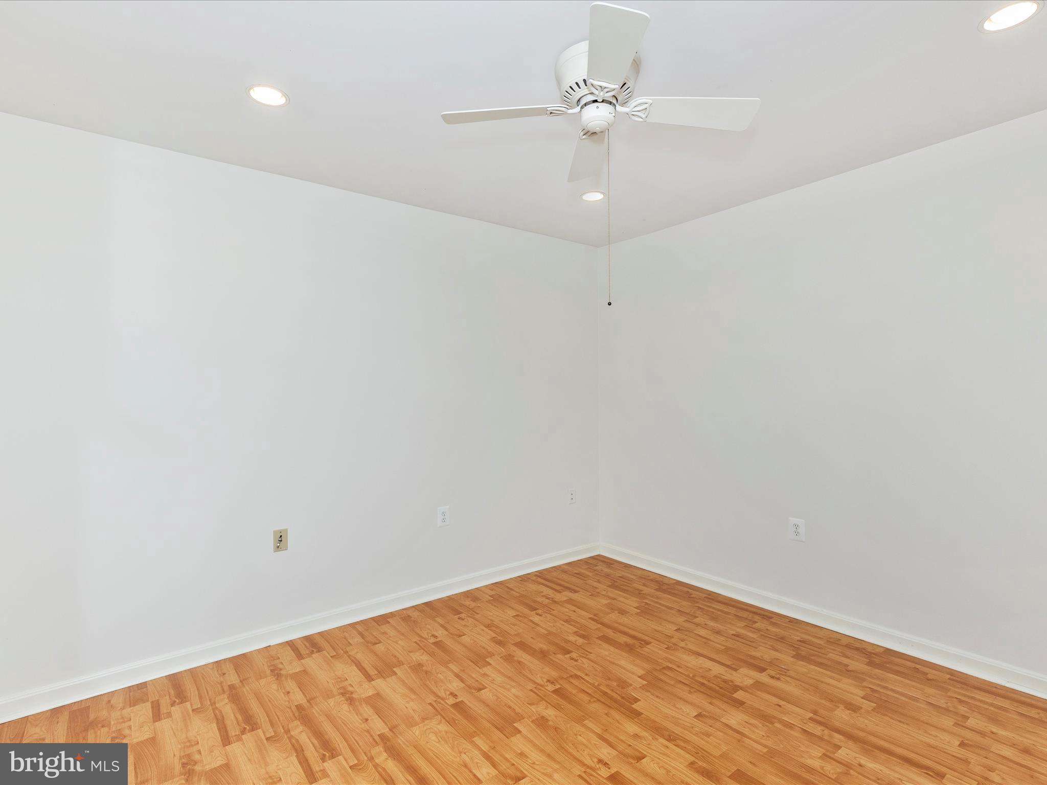 402 Windy Knoll Drive Mount Airy, MD 21771 - Photo 21 of 51 an empty room with a fan & a ceiling fan