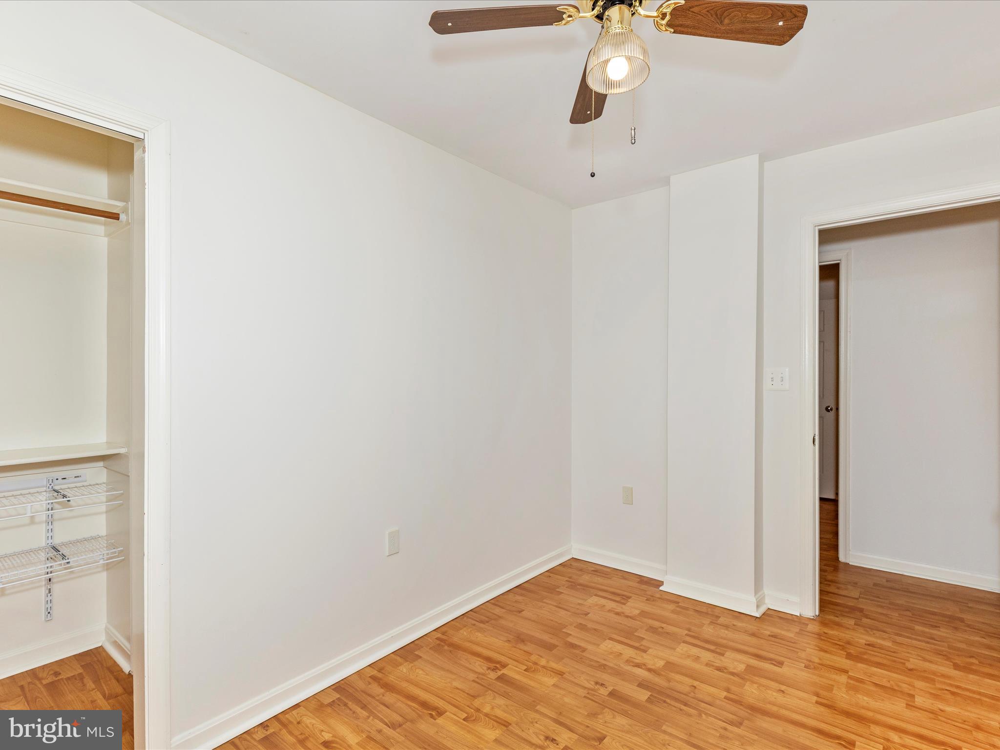 402 Windy Knoll Drive Mount Airy, MD 21771 - Photo 25 of 51 a view of an empty room with wooden floor