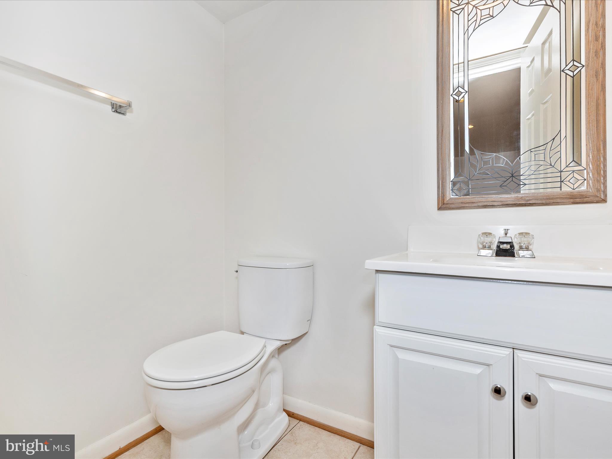 402 Windy Knoll Drive Mount Airy, MD 21771 - Photo 36 of 51 a bathroom with a sink mirror vanity and toilet