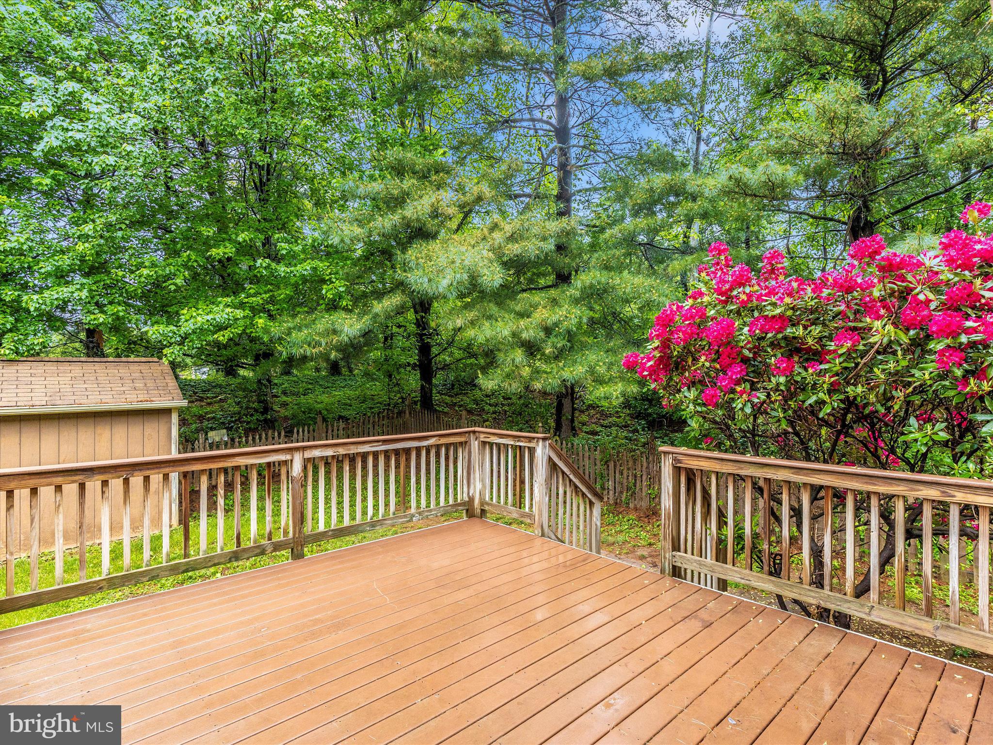 402 Windy Knoll Drive Mount Airy, MD 21771 - Photo 40 of 51 a view of a deck with a garden