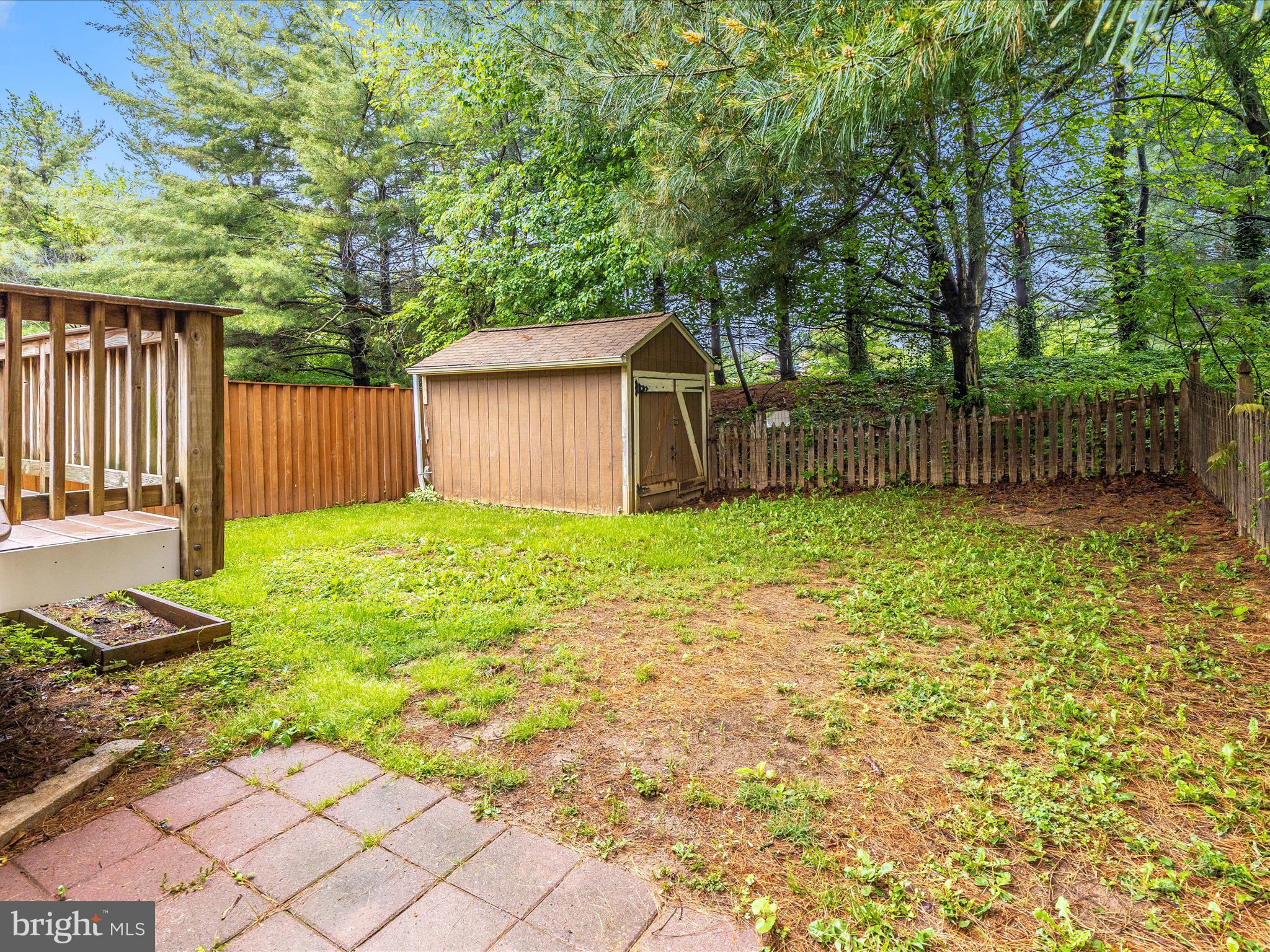 402 Windy Knoll Drive Mount Airy, MD 21771 - Photo 42 of 51 a view of a backyard with a small cabin and wooden fence
