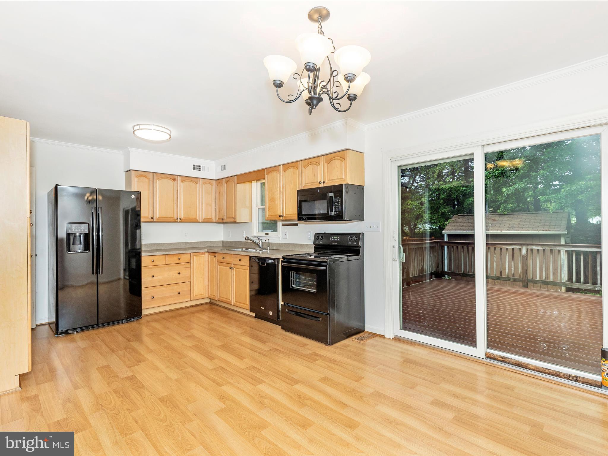 402 Windy Knoll Drive Mount Airy, MD 21771 - Photo 9 of 51 a large kitchen with stainless steel appliances granite countertop a refrigerator and a stove top oven