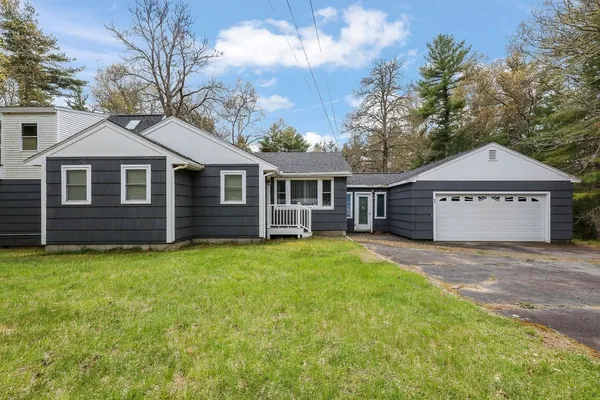 a view of a house with a yard