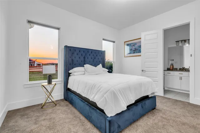 a bedroom with a bed and a table