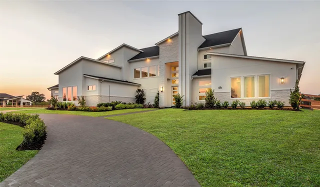 a front view of house with yard and outdoor seating